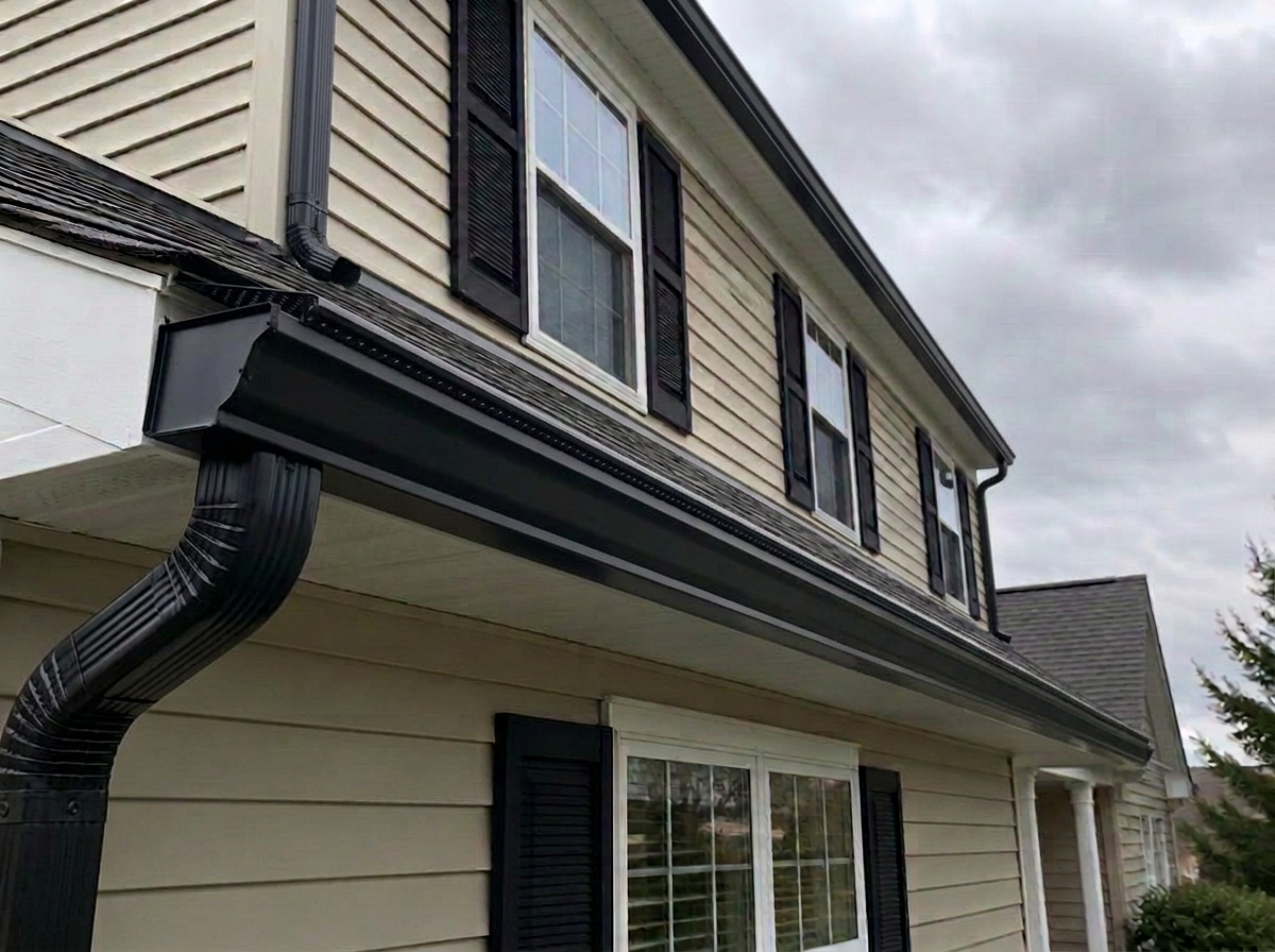 After: the same gutter protected by a Complete perforated metal gutter guard